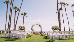 Ole Hanson Great Lawn wedding seating with ocean view backdrop