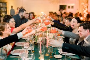 Wedding party toasts for bride and groom at reception