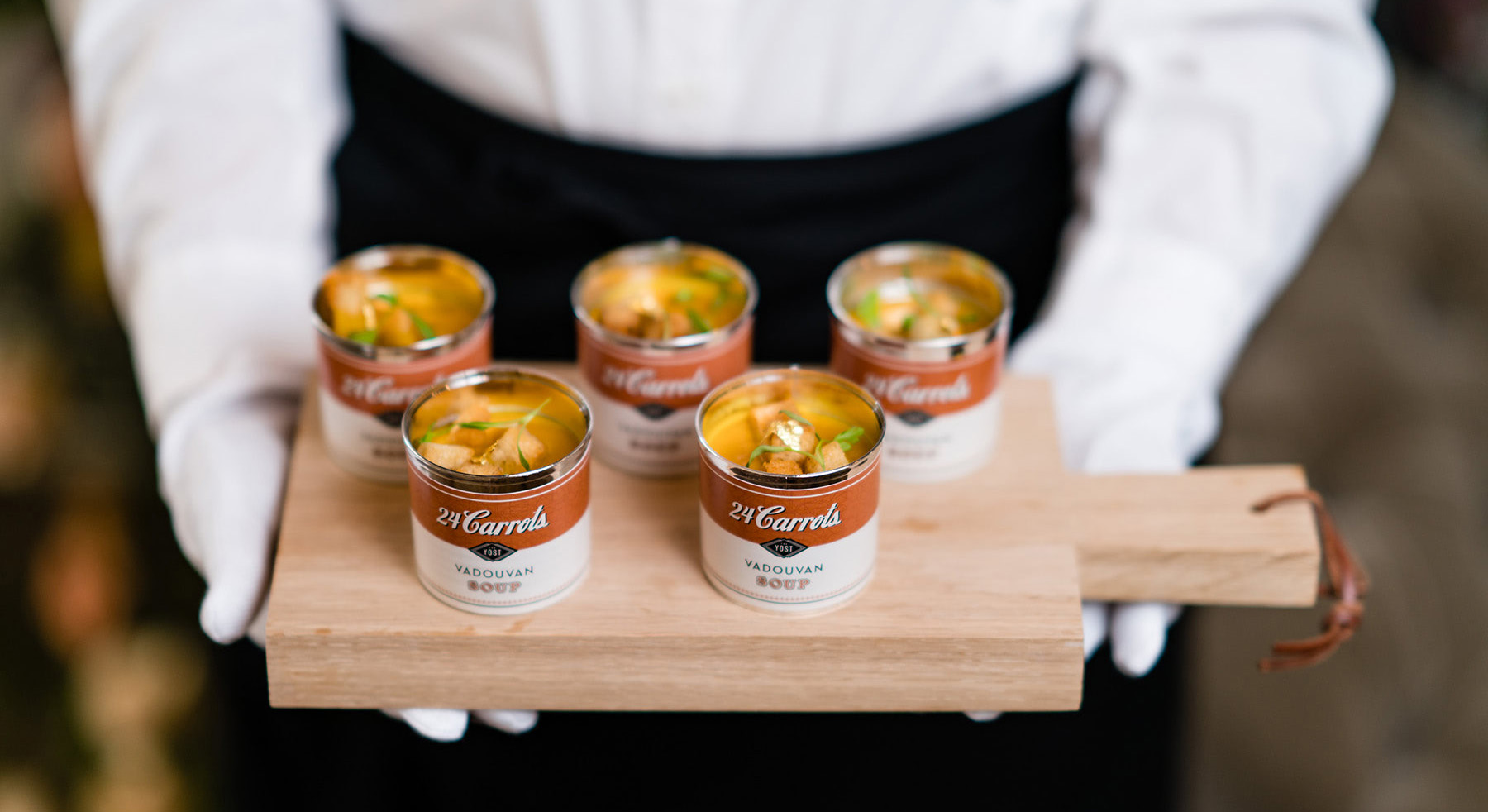 Photo of soup side dish served on tray in branded soup can